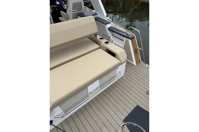 Slide: The Image of Luxury seating on the 2025 Balise Helix 26 L boat deck with cup holders. - 26
