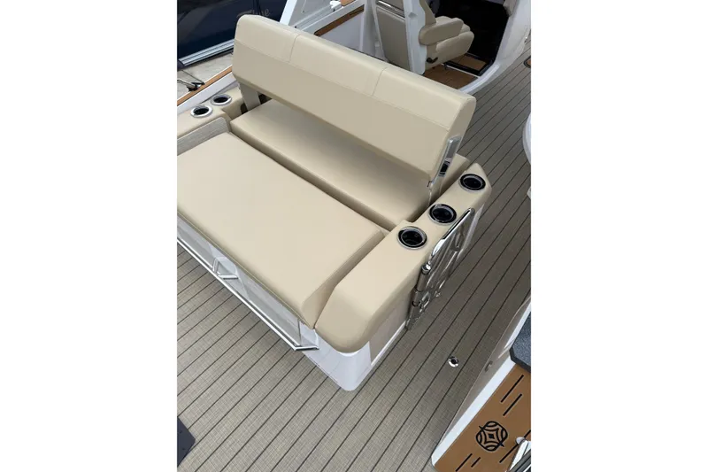 Slide: The Image of Beige seating on Balise Helix 26 L boat, 2025 model, with cup holders and sleek design. - 27