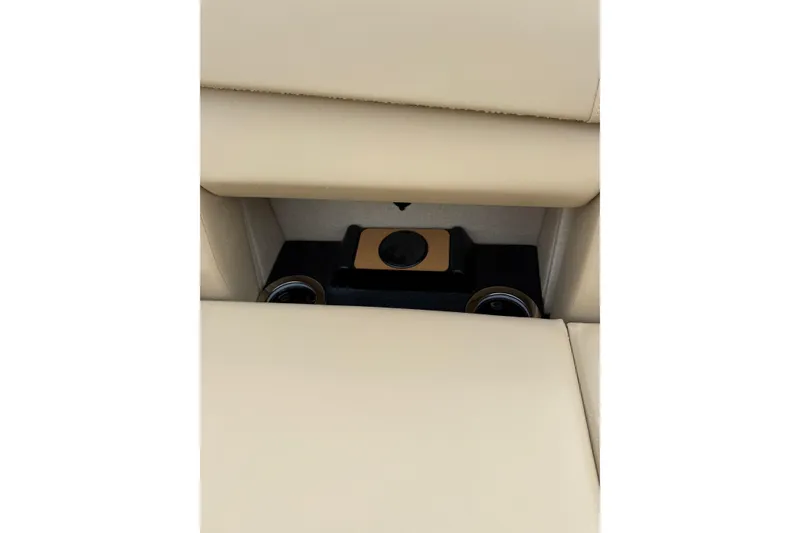 Slide: The Image of Beige interior of 2025 Balise Helix 26 L with hidden compartment and cup holders. - 29