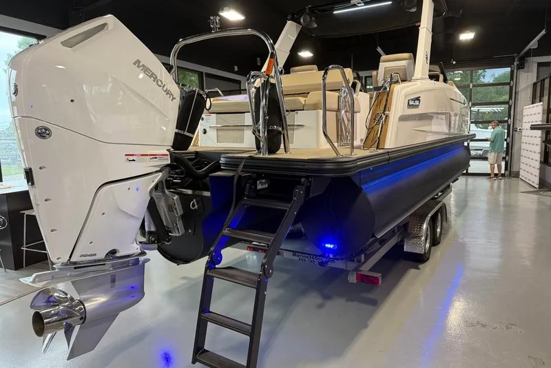 Slide: The Image of Balise Helix 26 L boat, 2025 model, on trailer with Mercury outboard motor. - 3