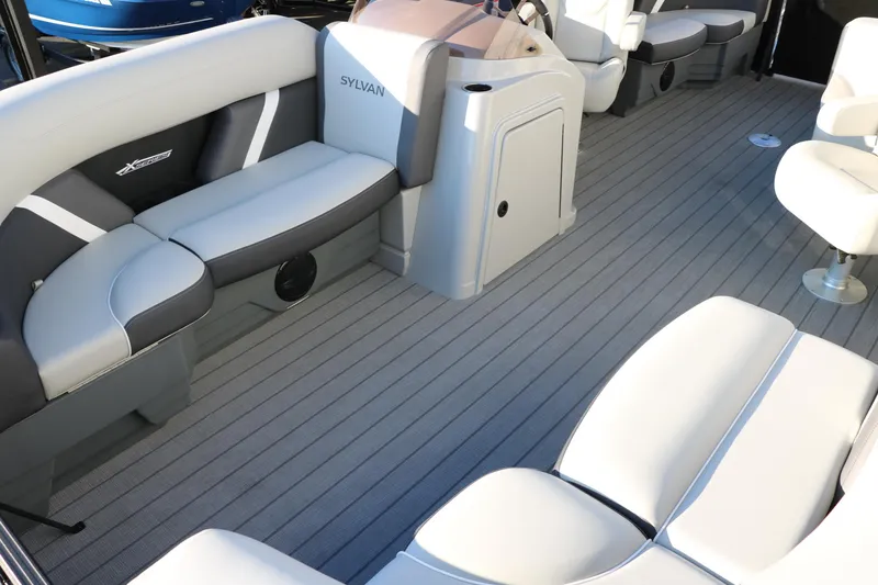 Slide: The Image of 2025 Sylvan Mirage X1 boat interior with sleek seating and modern design. - 14