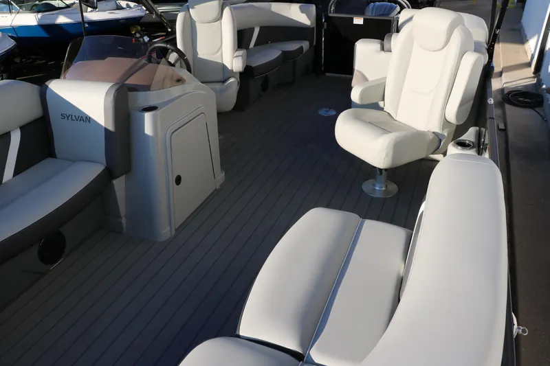 Slide: The Image of 2025 Sylvan Mirage X1 boat interior with luxurious seating and modern design. - 13