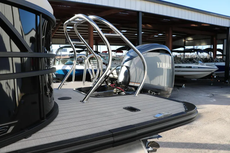 Slide: The Image of 2025 Sylvan Mirage X1 pontoon boat with Yamaha engine in a marina. - 5