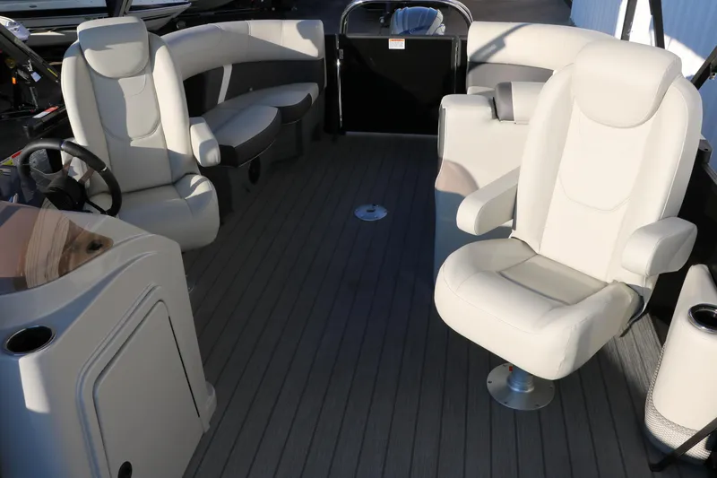 Slide: The Image of 2025 Sylvan Mirage X1 boat interior with plush seating and modern design. - 29
