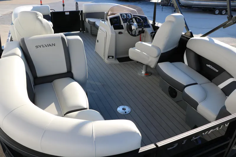 Slide: The Image of Luxurious 2025 Sylvan Mirage X1 pontoon boat interior with plush seating and modern helm. - 17