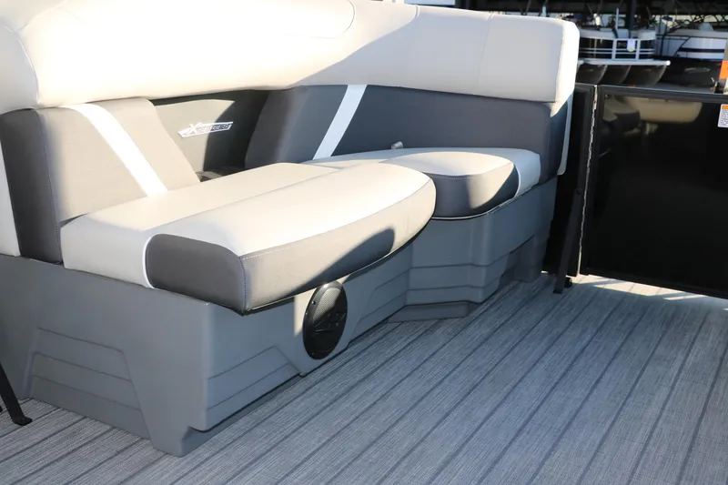 Slide: The Image of 2025 Sylvan Mirage X1 boat interior with gray seating and modern design. - 22