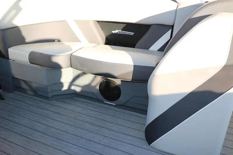 Slide: The Image of 2025 Sylvan Mirage X1 boat interior with modern seating and sleek design. - 23