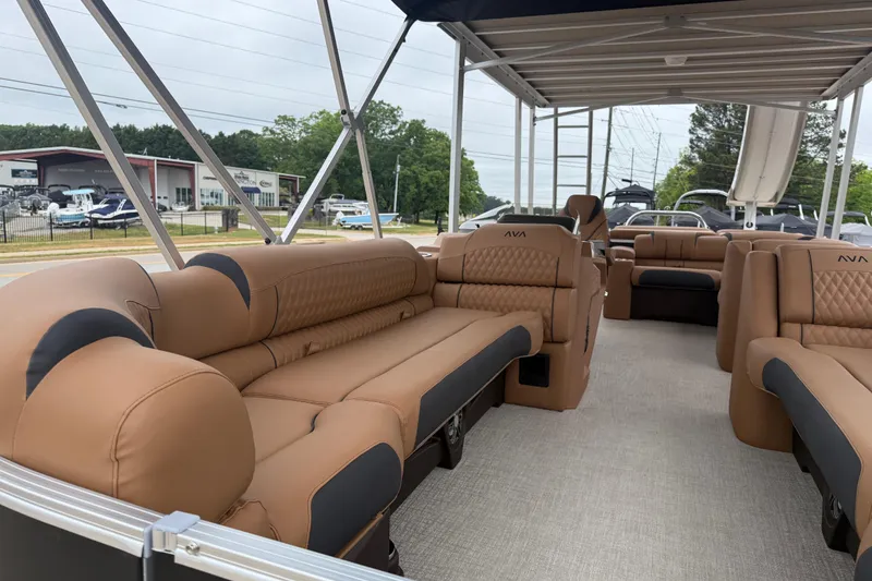 Slide: The Image of Luxurious interior of 2026 Avalon Catalina Cruise Funship pontoon boat with tan seating. - 10