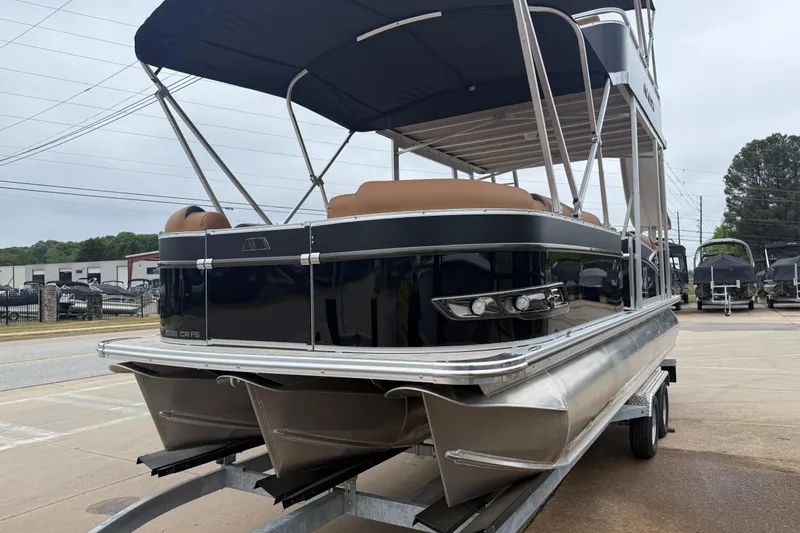 Slide: The Image of 2026 Avalon Catalina Cruise Funship 25' pontoon boat on trailer, featuring sleek design and canopy. - 2