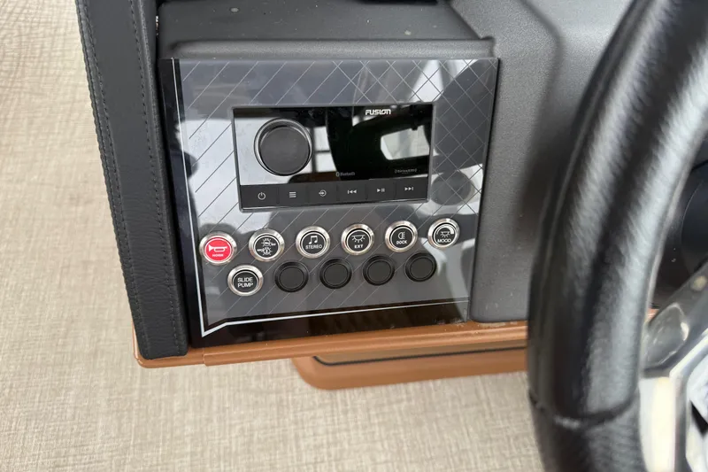 Slide: The Image of Control panel of 2026 Avalon Catalina Cruise Funship with stereo and function buttons. - 21