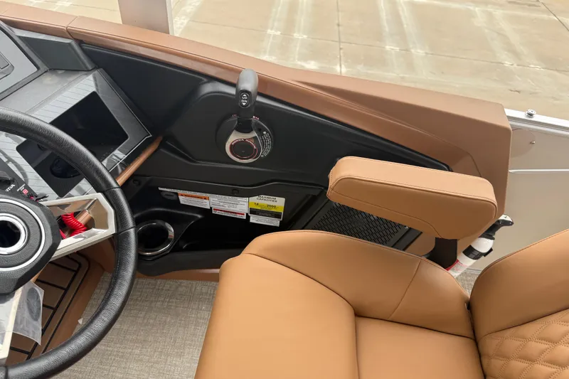 Slide: The Image of Interior of 2026 Avalon Catalina Cruise Funship, featuring steering wheel and tan seating. - 23