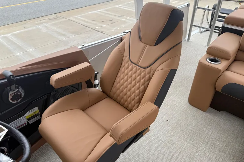 Slide: The Image of Luxurious captain's chair on 2026 Avalon Catalina Cruise Funship, featuring tan upholstery and armrests. - 24
