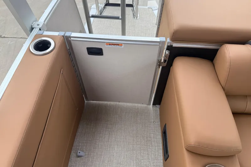 Slide: The Image of 2026 Avalon Catalina Cruise Funship interior with tan seating and cup holder. - 27