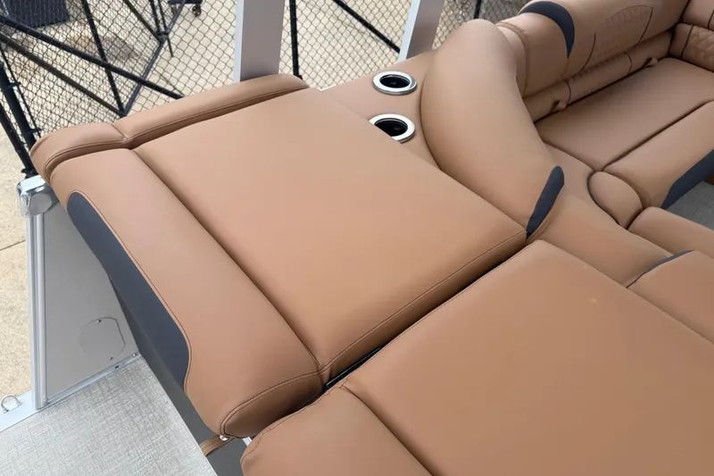 Slide: The Image of Luxurious seating on 2026 Avalon Catalina Cruise Funship, featuring tan upholstery and cup holders. - 30