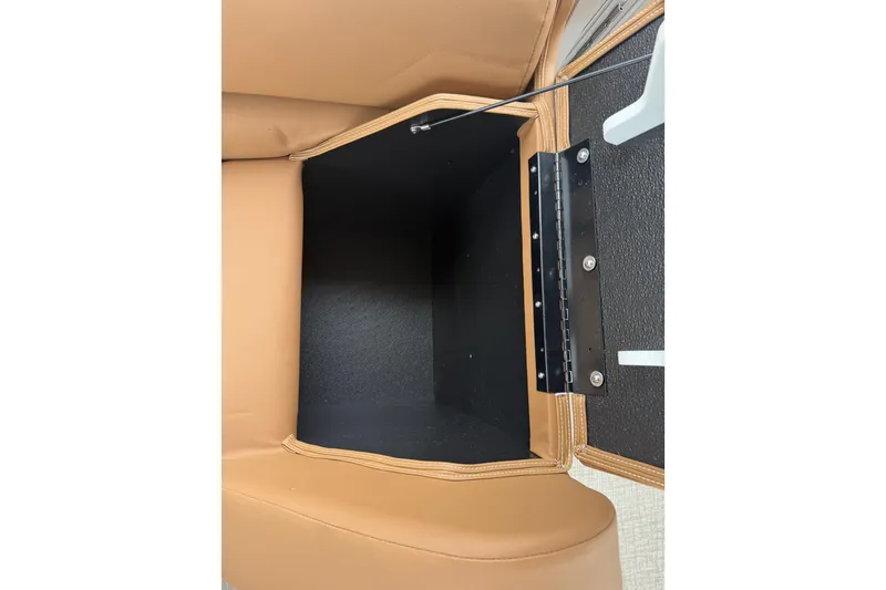 Slide: The Image of Storage compartment in 2026 Avalon Catalina Cruise Funship boat with tan upholstery. - 36