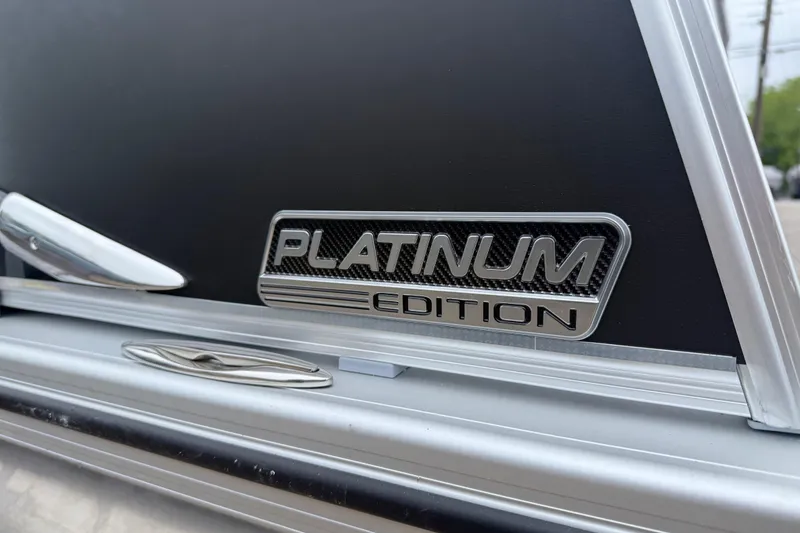 Slide: The Image of 2026 Avalon Catalina Cruise Funship 25' Platinum Edition emblem on sleek black surface. - 4
