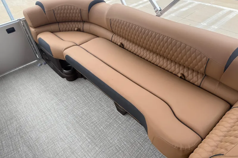 Slide: The Image of Luxurious seating on 2026 Avalon Catalina Cruise Funship, featuring tan upholstery and quilted design. - 41