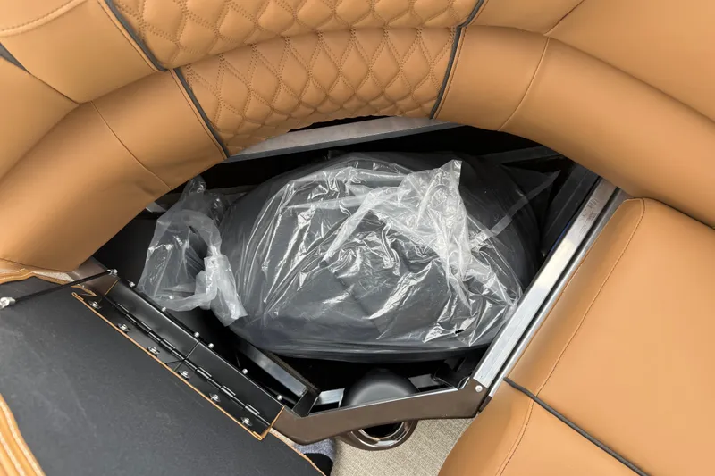 Slide: The Image of 2026 Avalon Catalina Cruise Funship interior storage with tan leather seating. - 45