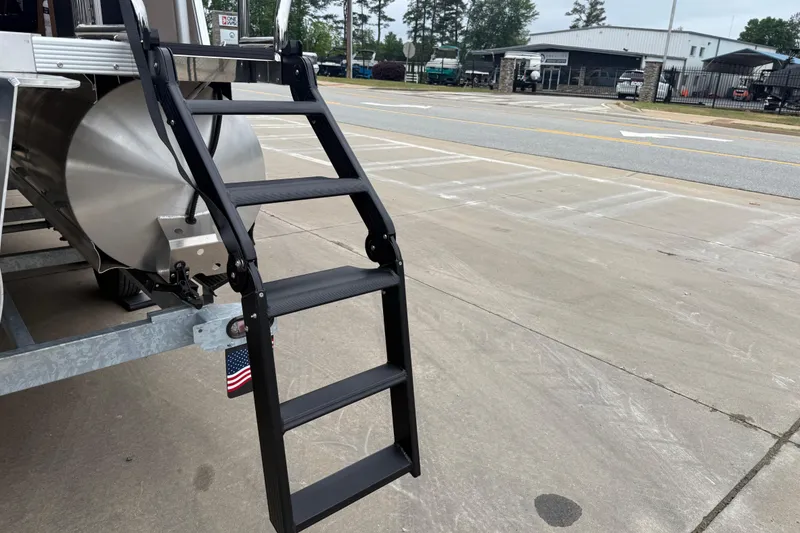 Slide: The Image of Ladder attached to 2026 Avalon Catalina Cruise Funship, parked on concrete surface. - 7