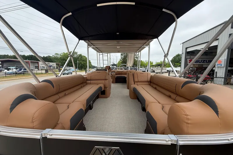 Slide: The Image of 2026 Avalon Catalina Cruise Funship 25' with spacious seating and canopy, parked outdoors. - 9