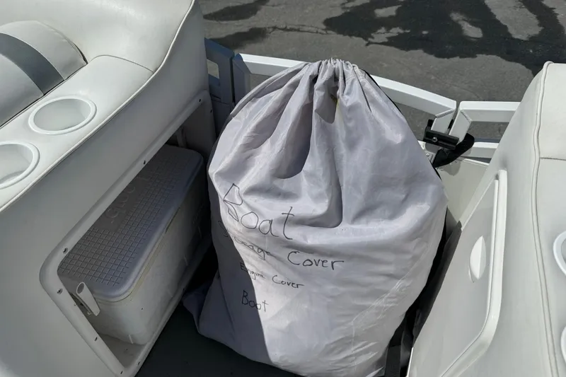 Slide: The Image of 2011 JC NEPTOON SPORT 21TT boat interior with storage bag and cooler. - 10