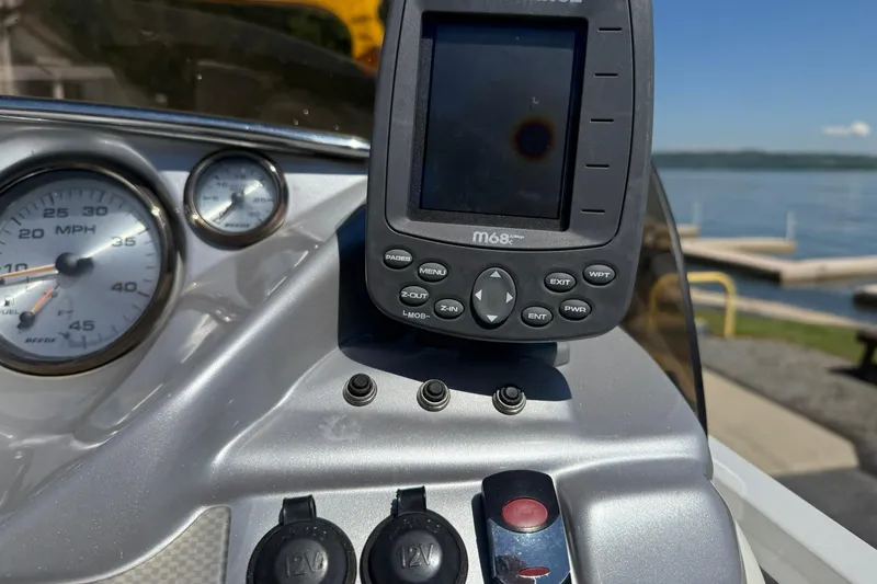 Slide: The Image of Dashboard of a 2011 JC NEPTOON SPORT 21TT boat with speedometer and GPS device. - 16