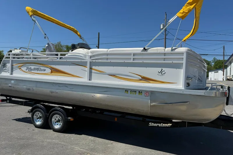 Slide: The Image of 2011 JC NEPTOON SPORT 21TT pontoon boat with yellow canopy on trailer. - 5