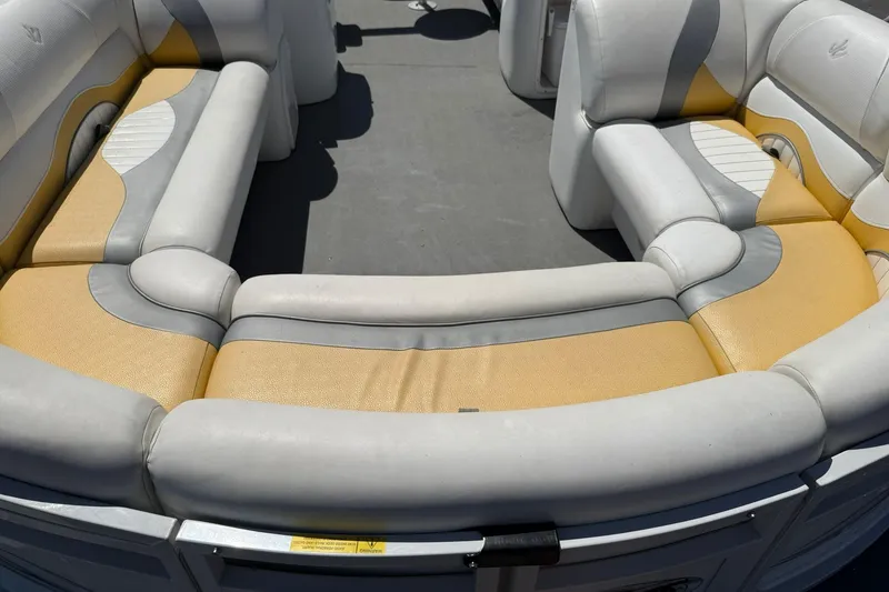 Slide: The Image of 2011 JC NEPTOON SPORT 21TT boat interior with beige and gray cushioned seating. - 6