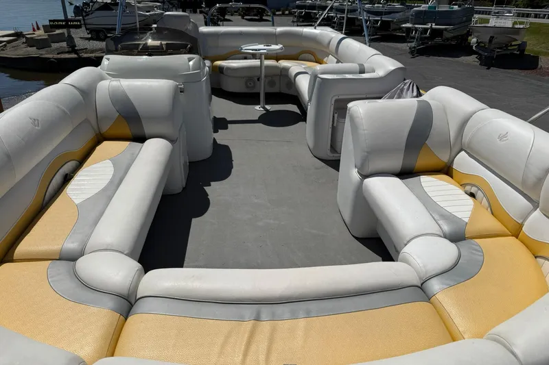 Slide: The Image of Spacious interior of 2011 JC NEPTOON SPORT 21TT pontoon boat with cushioned seating. - 7