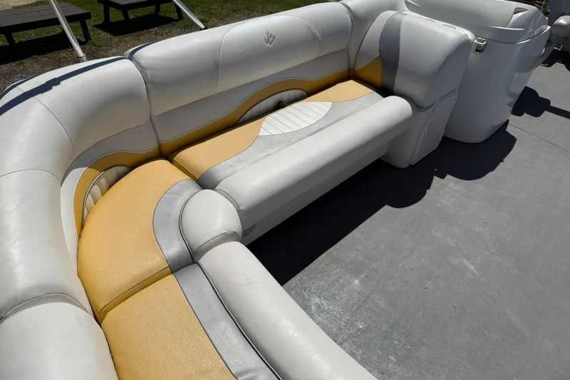 Slide: The Image of 2011 JC NEPTOON SPORT 21TT boat interior with yellow and white cushioned seating. - 9