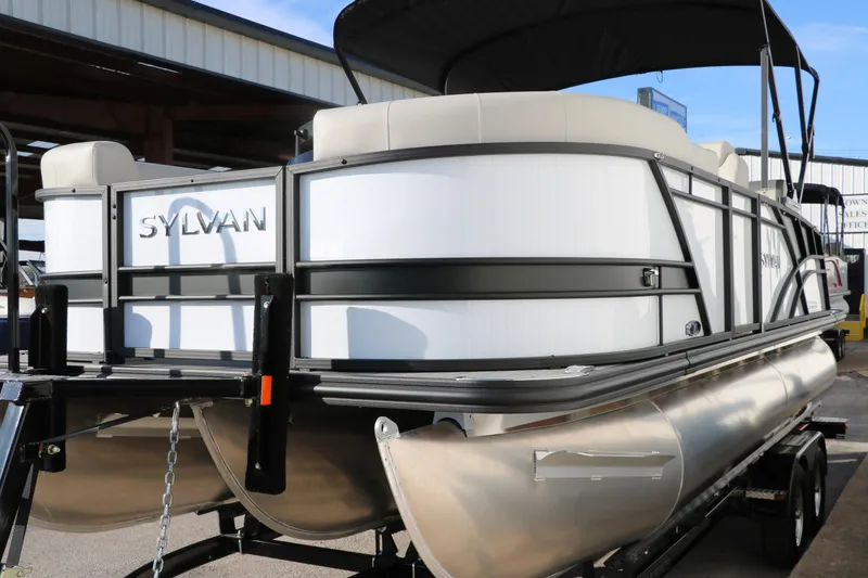 Slide: The Image of 2025 Sylvan Mirage X X1 CLZ DH pontoon boat on trailer, rear view. - 10