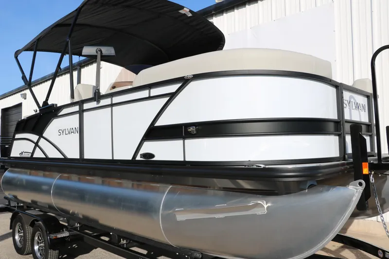 Slide: The Image of 2025 Sylvan Mirage X X1 CLZ DH pontoon boat on trailer, side view. - 11