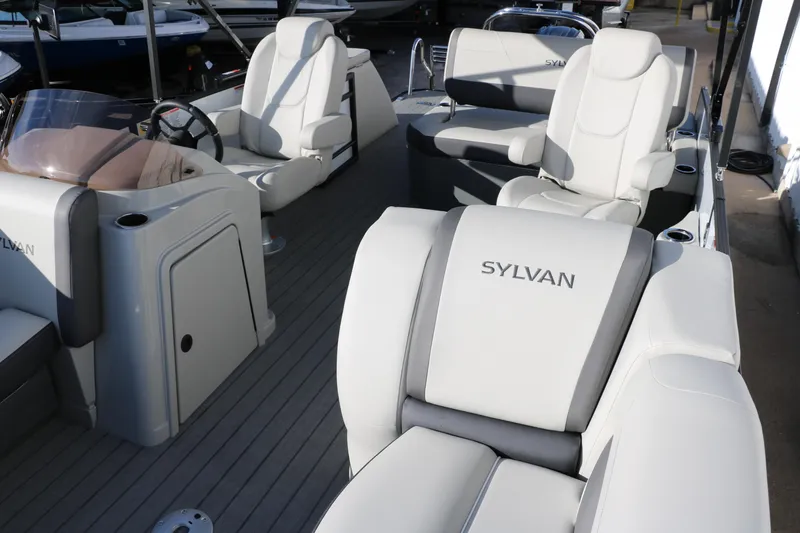 Slide: The Image of 2025 Sylvan Mirage X X1 CLZ DH boat interior with luxurious seating and modern design. - 14
