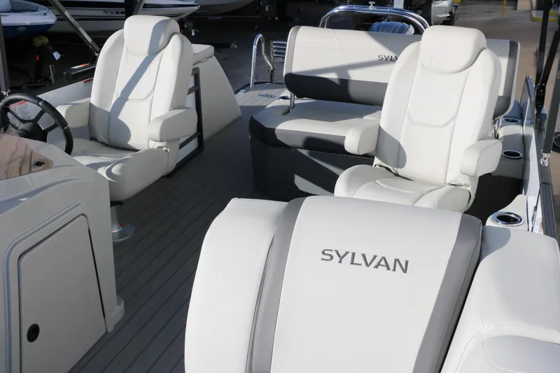 Slide: The Image of Luxurious 2025 Sylvan Mirage X X1 CLZ DH boat interior with plush seating. - 16