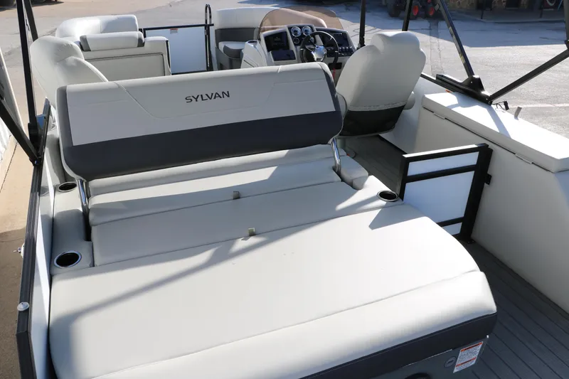 Slide: The Image of 2025 Sylvan Mirage X X1 CLZ DH pontoon boat interior with plush seating and modern dashboard. - 17