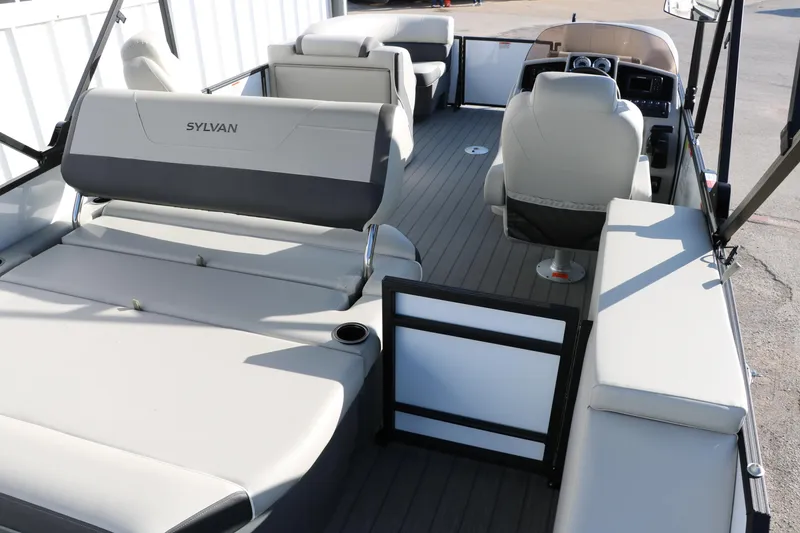 Slide: The Image of 2025 Sylvan Mirage X X1 CLZ DH pontoon boat interior with modern seating and helm. - 20