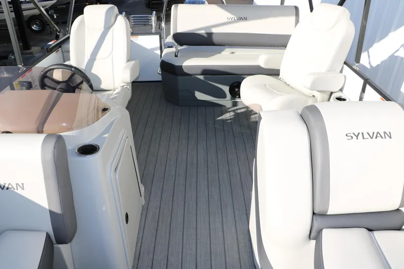 Slide: The Image of 2025 Sylvan Mirage X X1 CLZ DH pontoon boat interior with plush seating and steering console. - 21