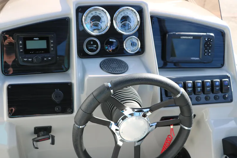 Slide: The Image of Steering console of 2025 Sylvan Mirage X X1 CLZ DH with gauges and navigation system. - 28