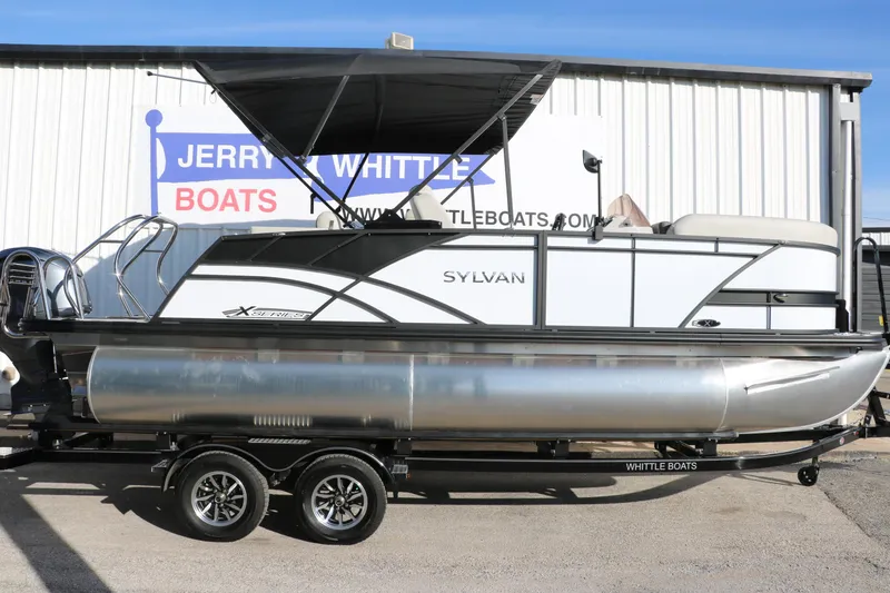 Slide: The Image of 2025 Sylvan Mirage X X1 CLZ DH pontoon boat displayed at dealership. - 3