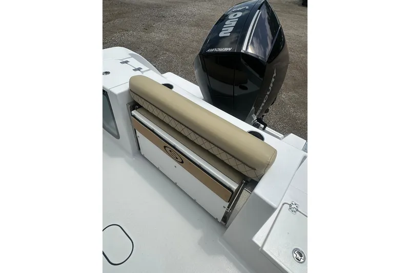 Slide: The Image of 2026 Sportsman Open 232 Center Console boat with Mercury engine and cushioned seating. - 11