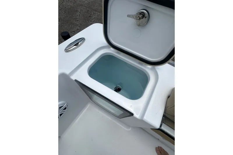 Slide: The Image of Open livewell on 2026 Sportsman Open 232 Center Console boat. - 14