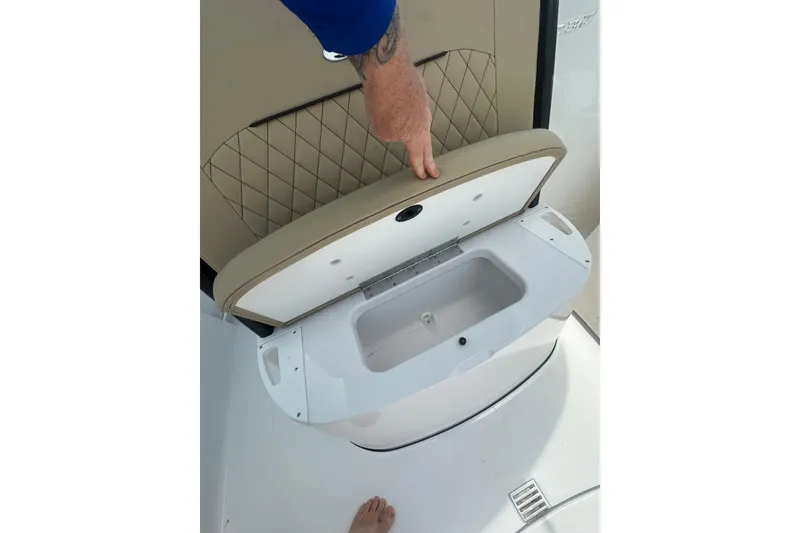 Slide: The Image of Open storage compartment on 2026 Sportsman Open 232 Center Console boat. - 29