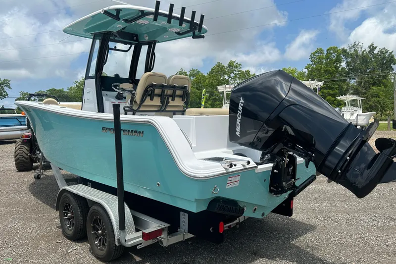 Slide: The Image of 2026 Sportsman Open 232 Center Console boat with Mercury engine on trailer. - 3