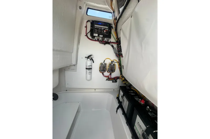 Slide: The Image of Interior view of 2026 Sportsman Open 232 Center Console boat's electrical system. - 32