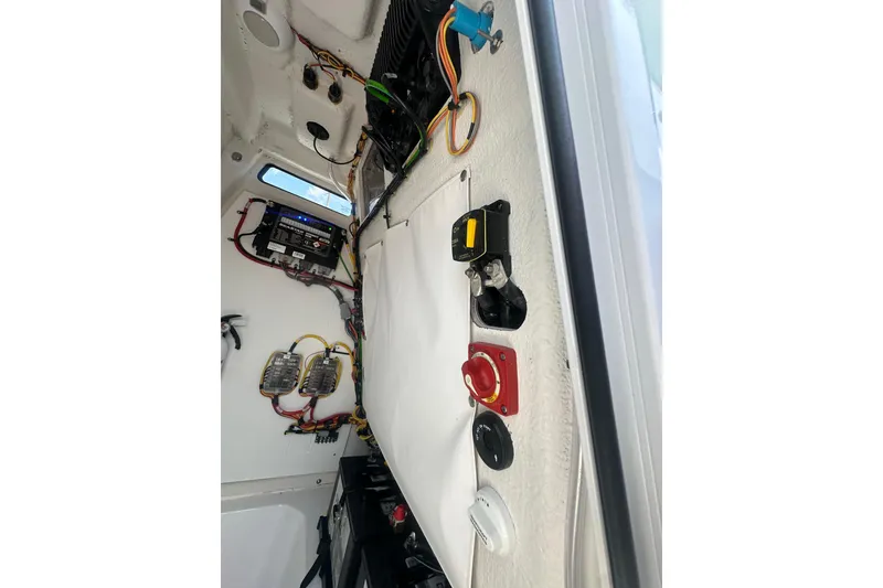 Slide: The Image of Interior wiring and controls of 2026 Sportsman Open 232 Center Console boat. - 33