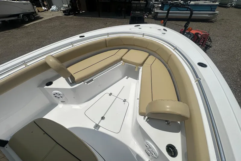 Slide: The Image of 2026 Sportsman Open 232 Center Console boat with tan seating and spacious deck. - 35