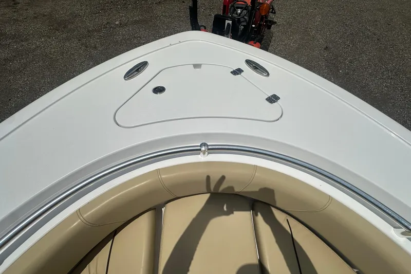 Slide: The Image of Bow view of 2026 Sportsman Open 232 Center Console boat with beige seating. - 36