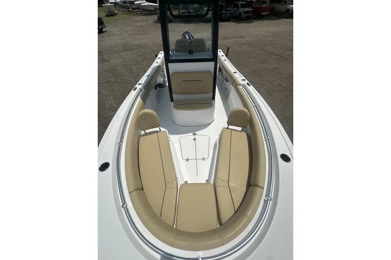 Slide: The Image of 2026 Sportsman Open 232 Center Console boat with tan seating and sleek design. - 39