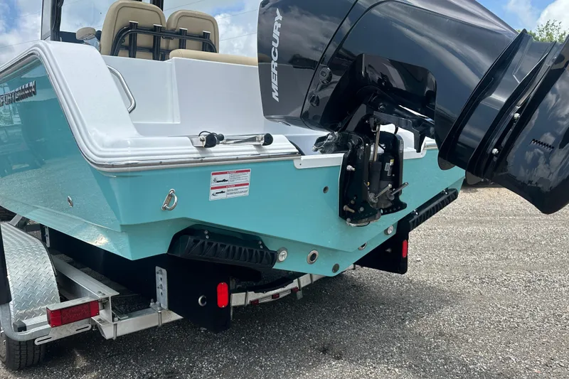 Slide: The Image of 2026 Sportsman Open 232 Center Console boat with Mercury engine on trailer. - 4