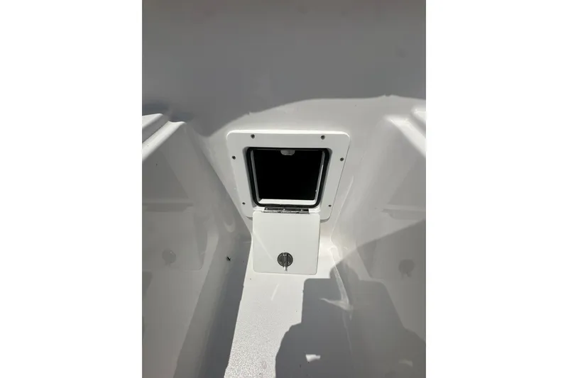 Slide: The Image of 2026 Sportsman Open 232 Center Console storage compartment detail. - 41